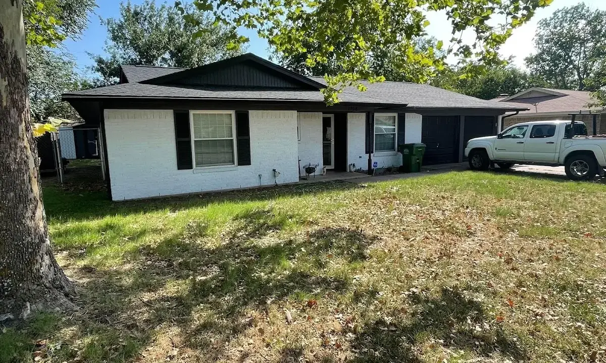 Professional roofing crew working on a residential roof in San Dimas